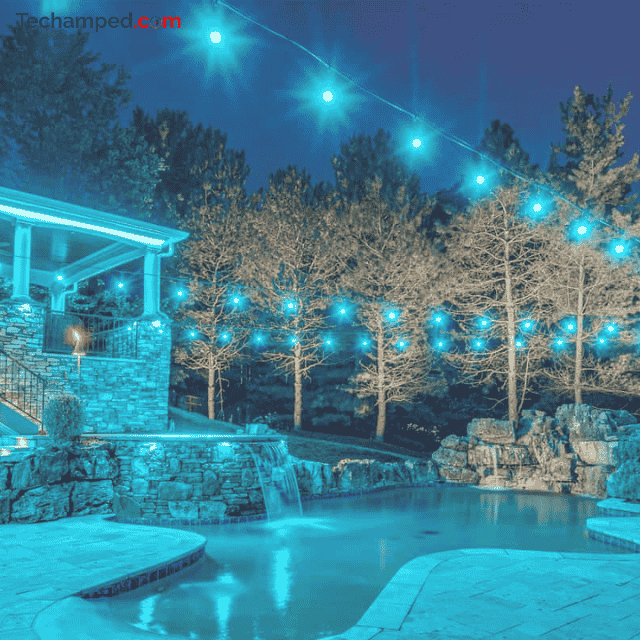 backyard illuminated with color-changing LED string lights