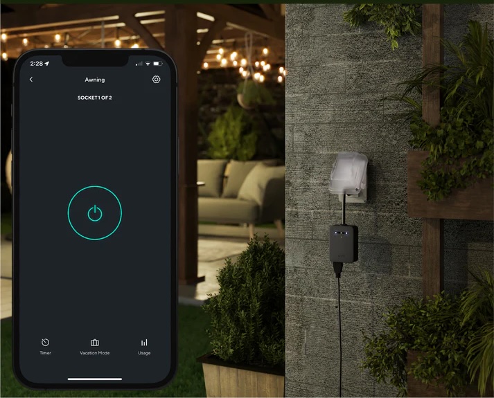 A backyard illuminated with vibrant smart color string lights controlled by an outdoor smart plug